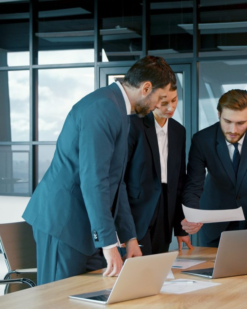 Corporate business team in a meeting. Group of young people in suits